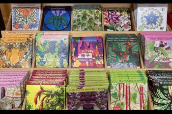 A seed packet display shows the many choices that herb lovers have.