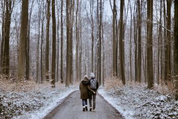 A young couple enjoy a winter walk. vidence has mounted that being active in nature can improve our overall health — psychologically, physiologically and attitudinally. 