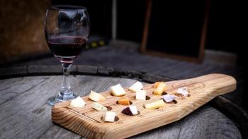 Glass of wine with cheese board